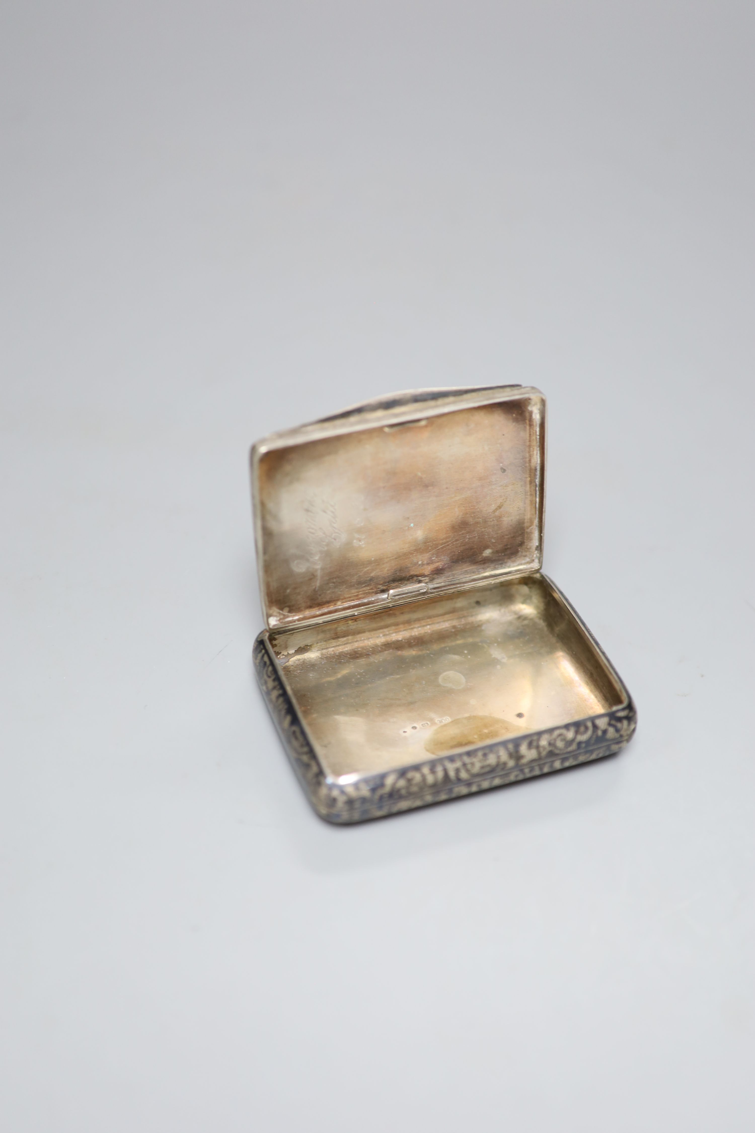 A late 19th century Russian 84 zolotnik and niello cigarette case, 89mm and an Austro-Hungarian 900 standard white metal and niello cigarette case, gross 7oz.
